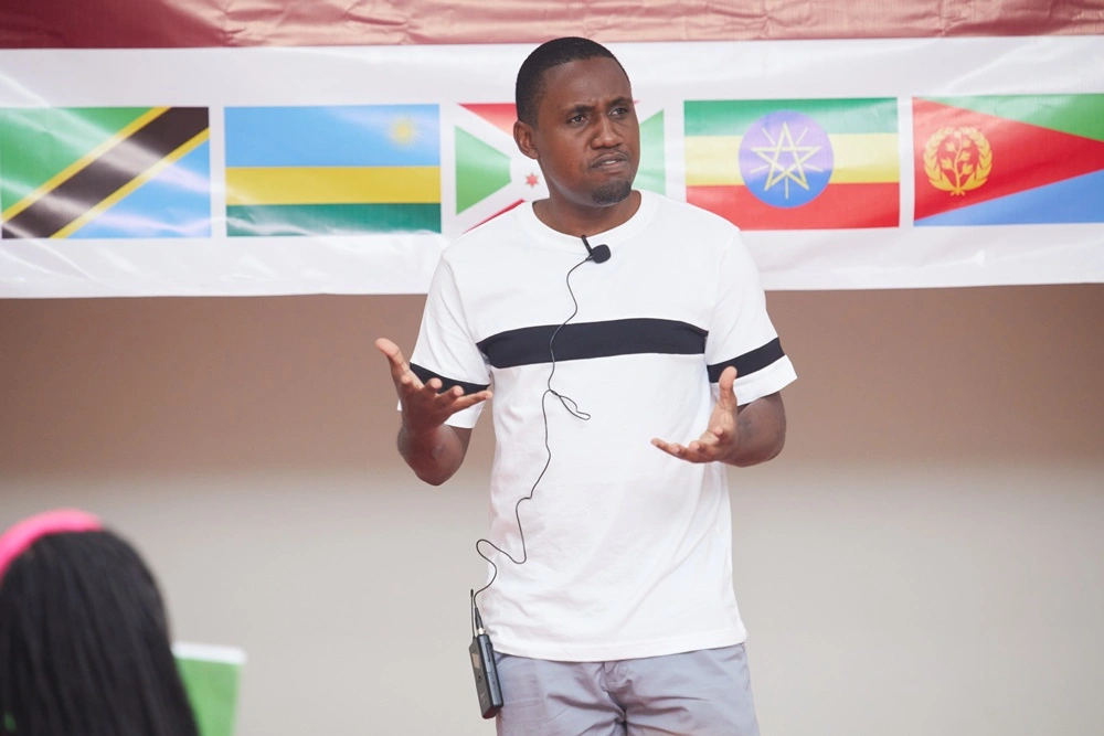 Daudi Mugabi speaking at a regional conference